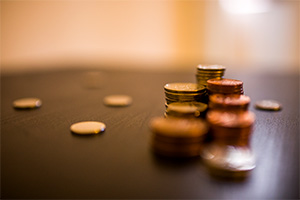 A stack of coins. Edinburgh's GD Estate Planning can advise on Power Of Attorney, among many other issues.